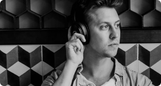 Young man listening to music with headphones